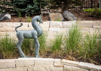 bronze horse sculpture in garden