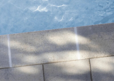 stone walkway with pool